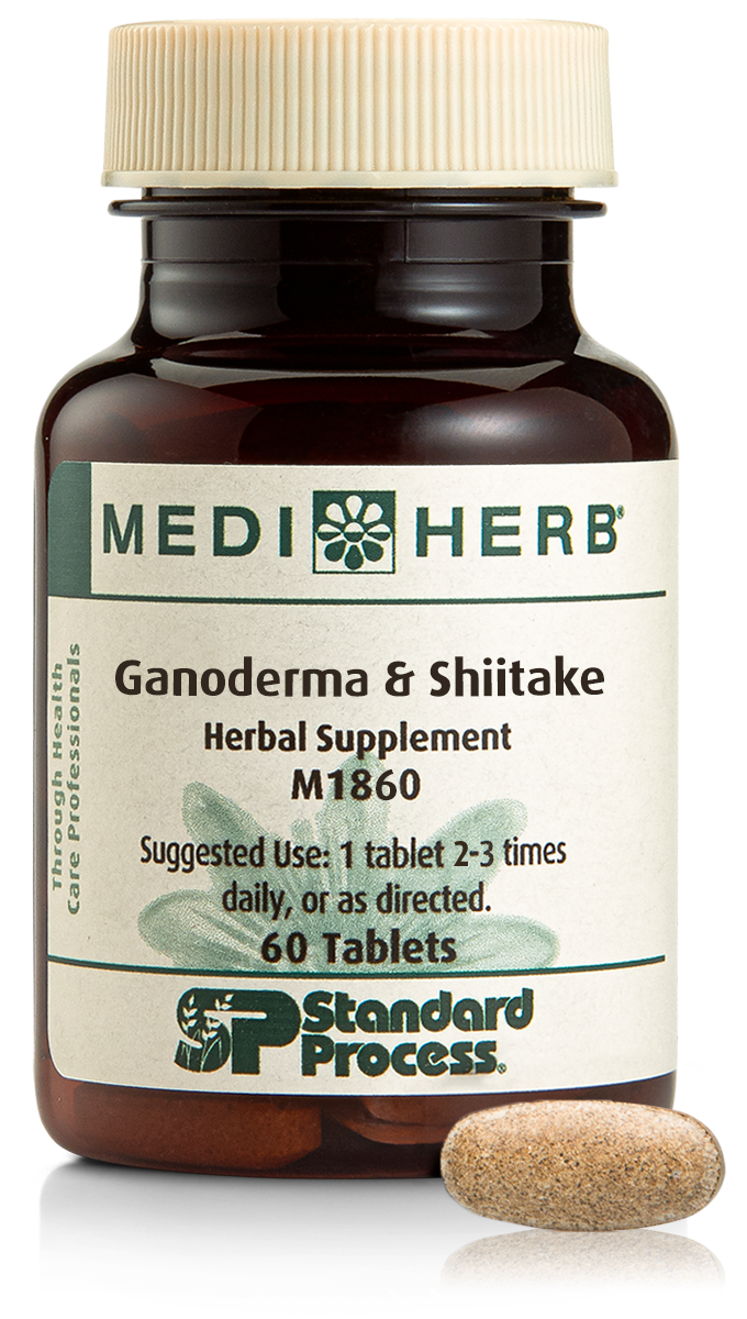A bottle of Ganoderma & Shiitake herbal supplement next to a tablet.